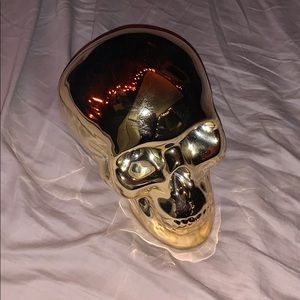 gold metal skull piggybank